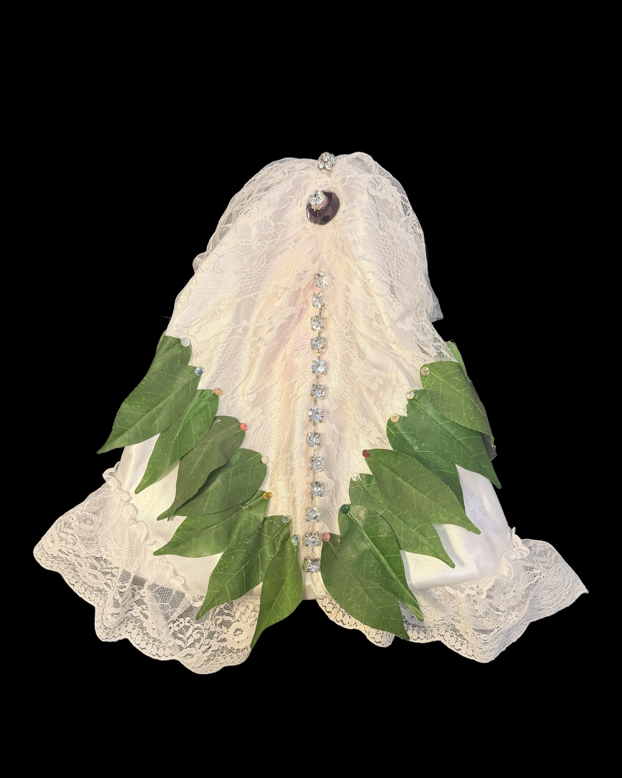  Ascension Spirit   
Soft Sculpture 
 Found Materials   
Discarded Doll, Fabric,  
Found Natural Materials,  
Costume Jewelry, Plastic Gems