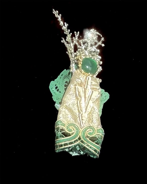  Ascension Spirit   
Soft Sculpture 
 Found Materials   
Discarded Doll, Fabric,  
Found Natural Materials,  
Costume Jewelry, Plastic Gems