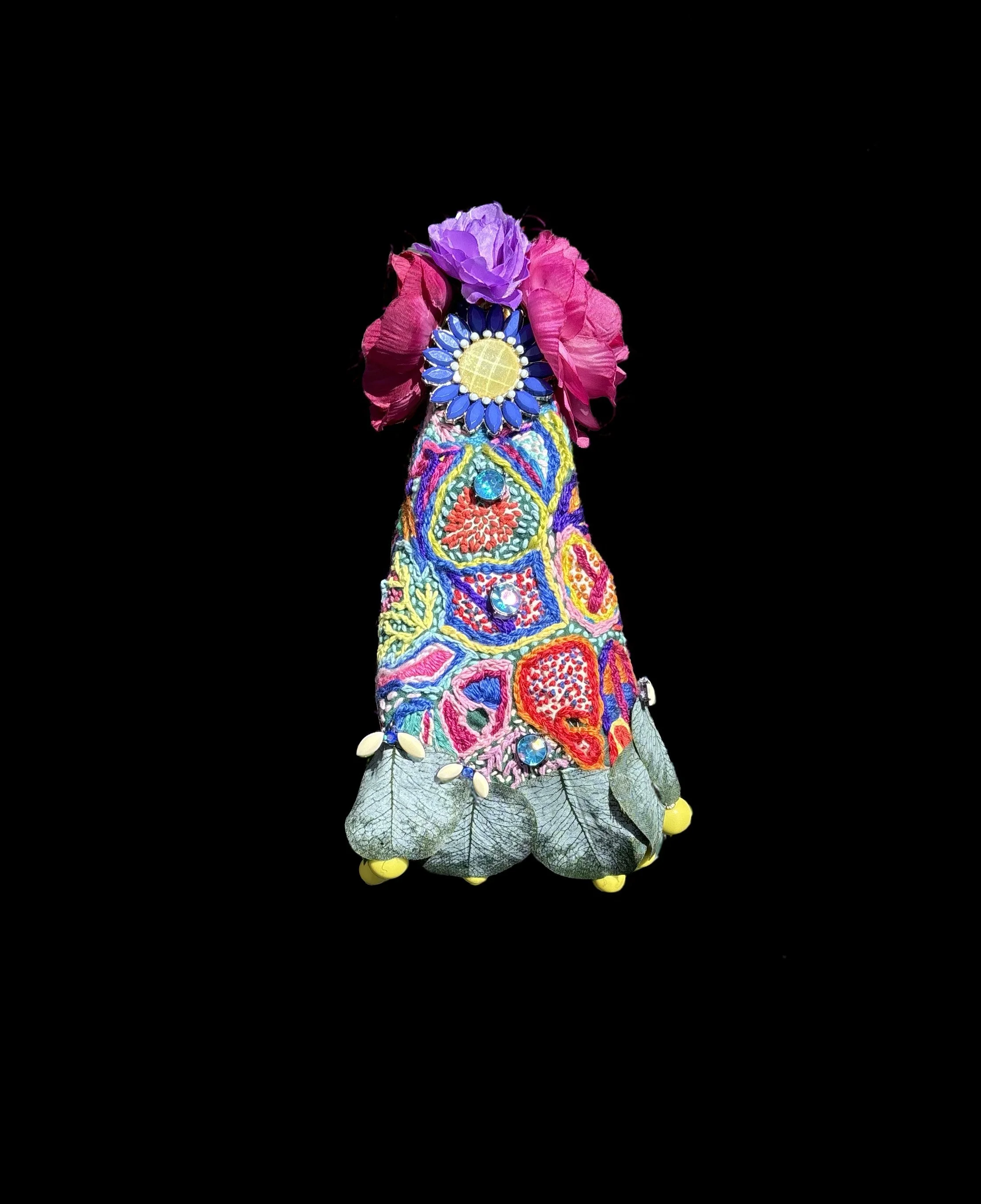  Ascension Spirit   
Soft Sculpture 
 Found Materials   
Discarded Doll, Fabric,  
Found Natural Materials,  
Costume Jewelry, Plastic Gems