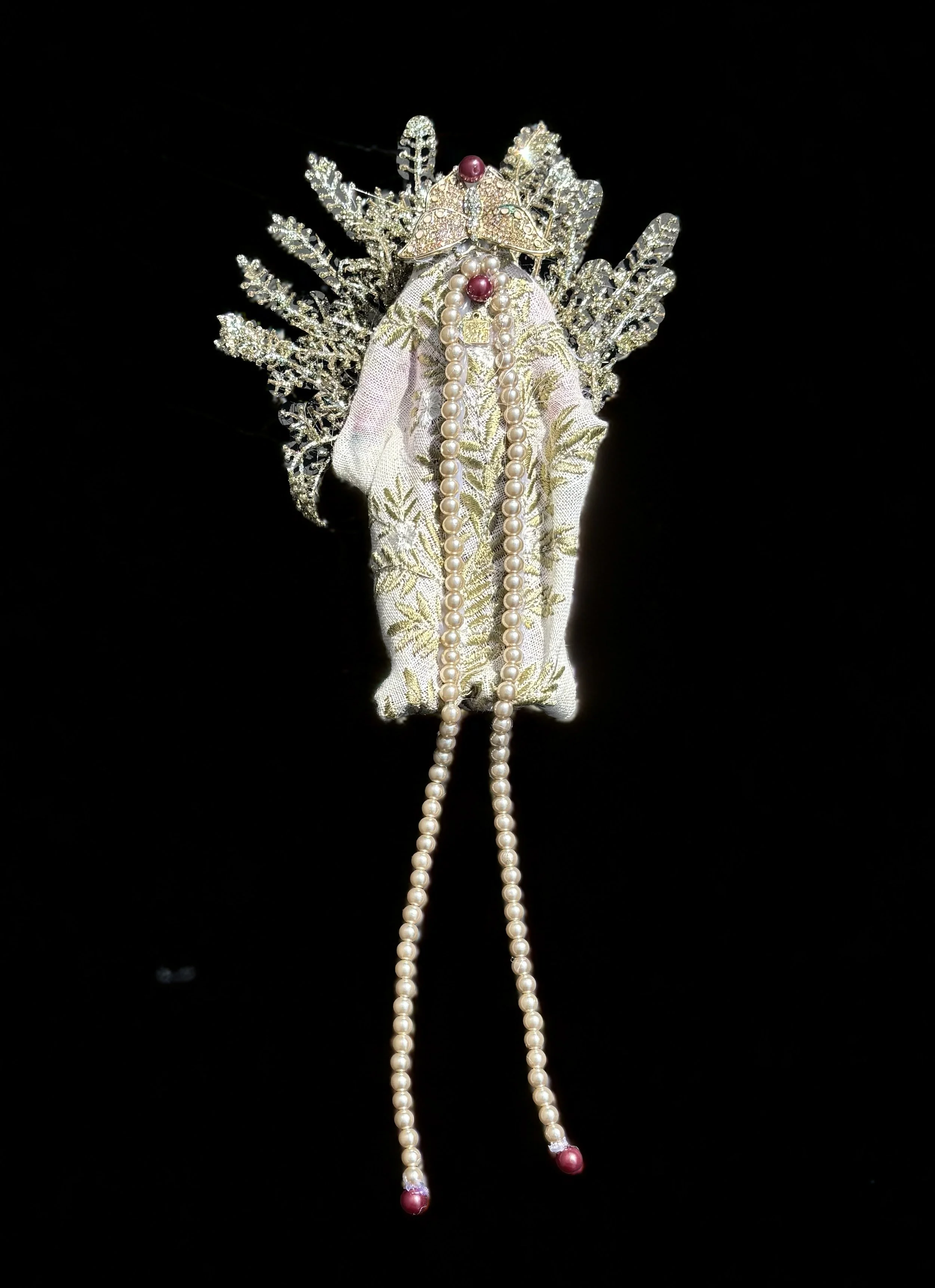  Ascension Spirit   
Soft Sculpture 
 Found Materials   
Discarded Doll, Fabric,  
Found Natural Materials,  
Costume Jewelry, Plastic Gems