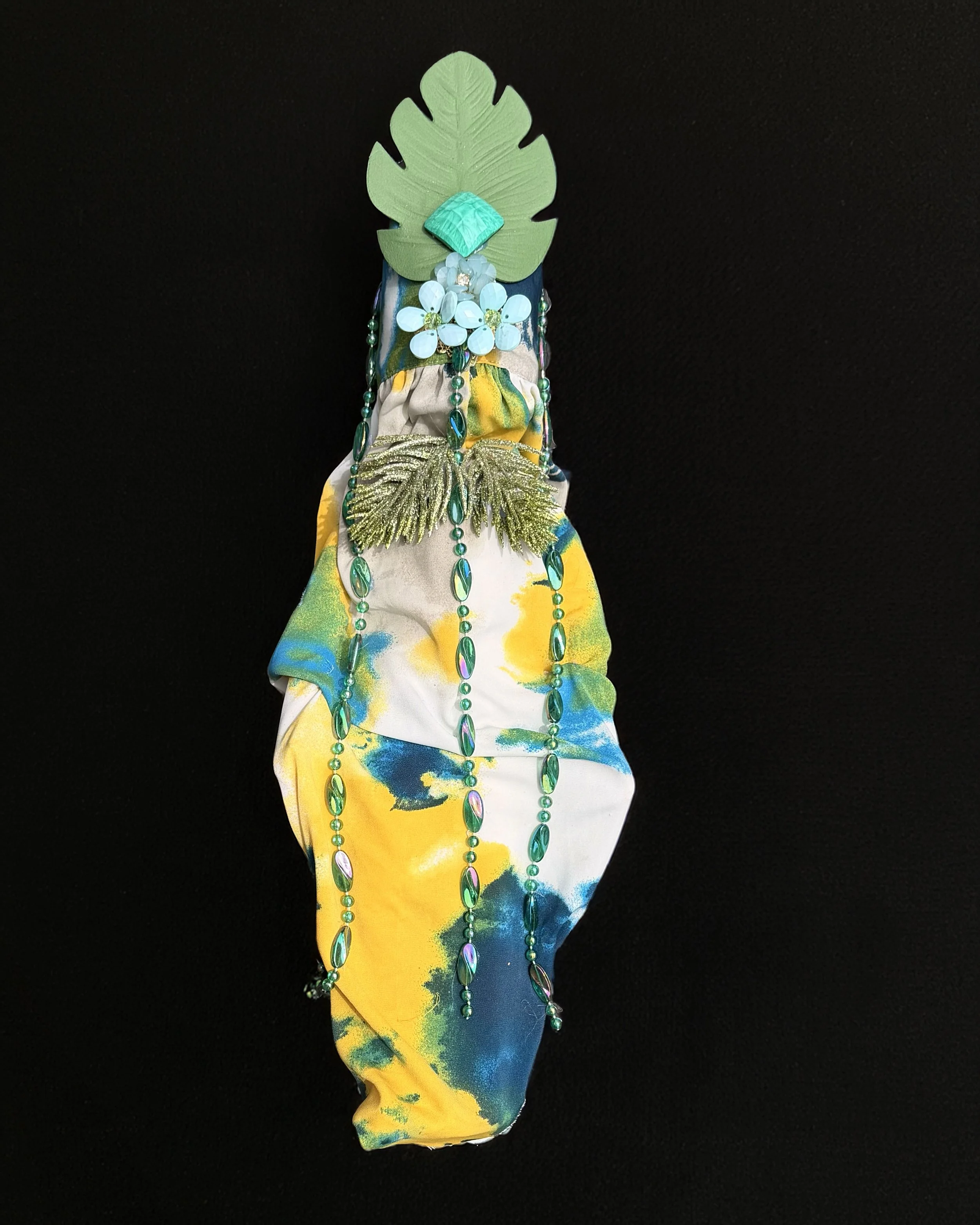  Ascension Spirit   
Soft Sculpture 
 Found Materials   
Discarded Doll, Fabric,  
Found Natural Materials,  
Costume Jewelry, Plastic Gems