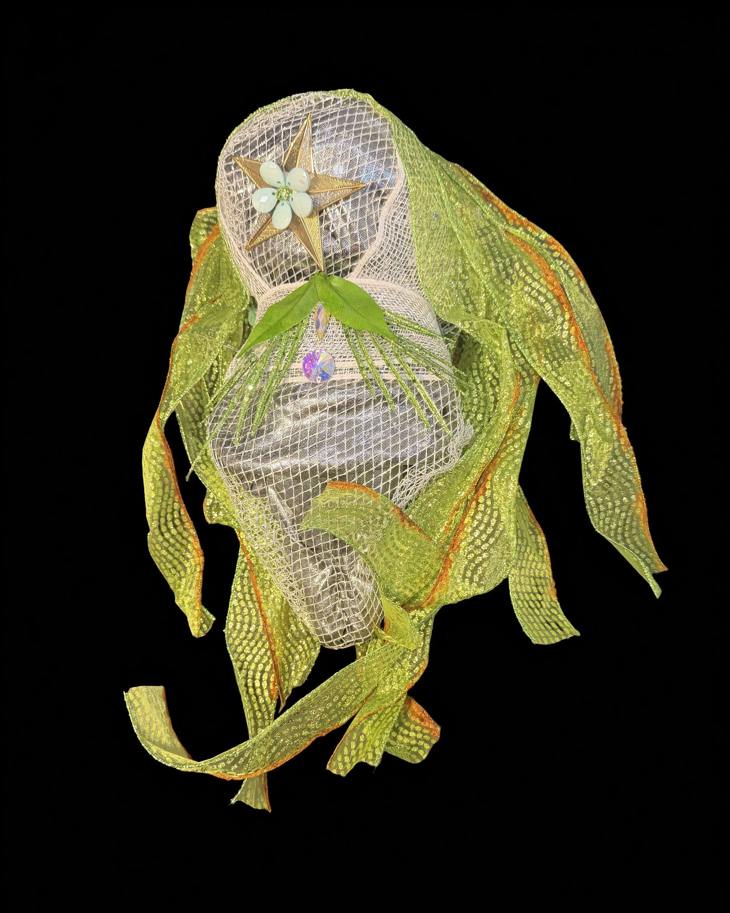  Ascension Spirit   
Soft Sculpture 
 Found Materials   
Discarded Doll, Fabric,  
Found Natural Materials,  
Costume Jewelry, Plastic Gems