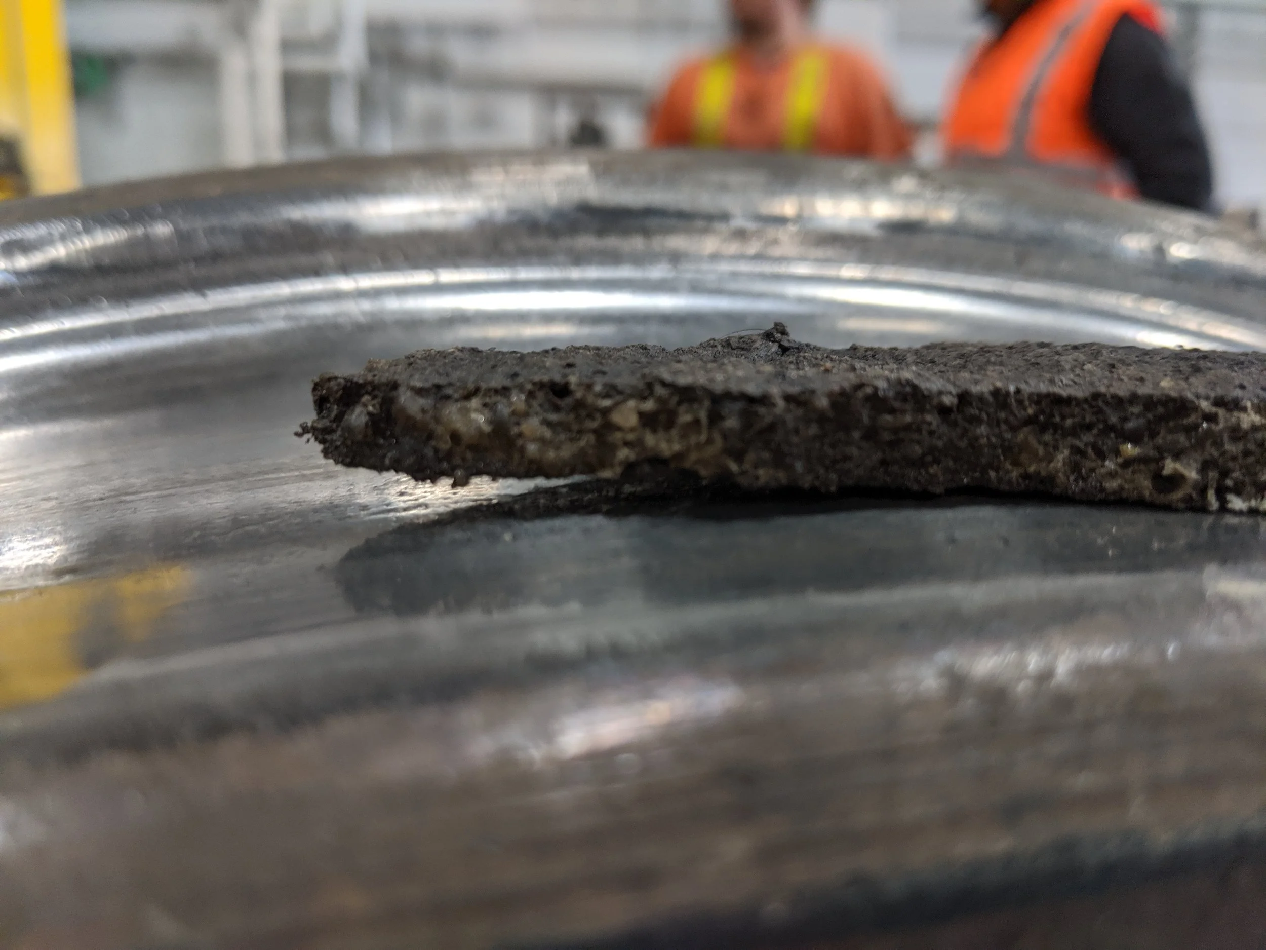 Previous resin floor failed in less than 3 months. SureBond had to remove about 25mm of oil contaminated material, and then prepare / de-contaminate the slab just to start the re-build work.