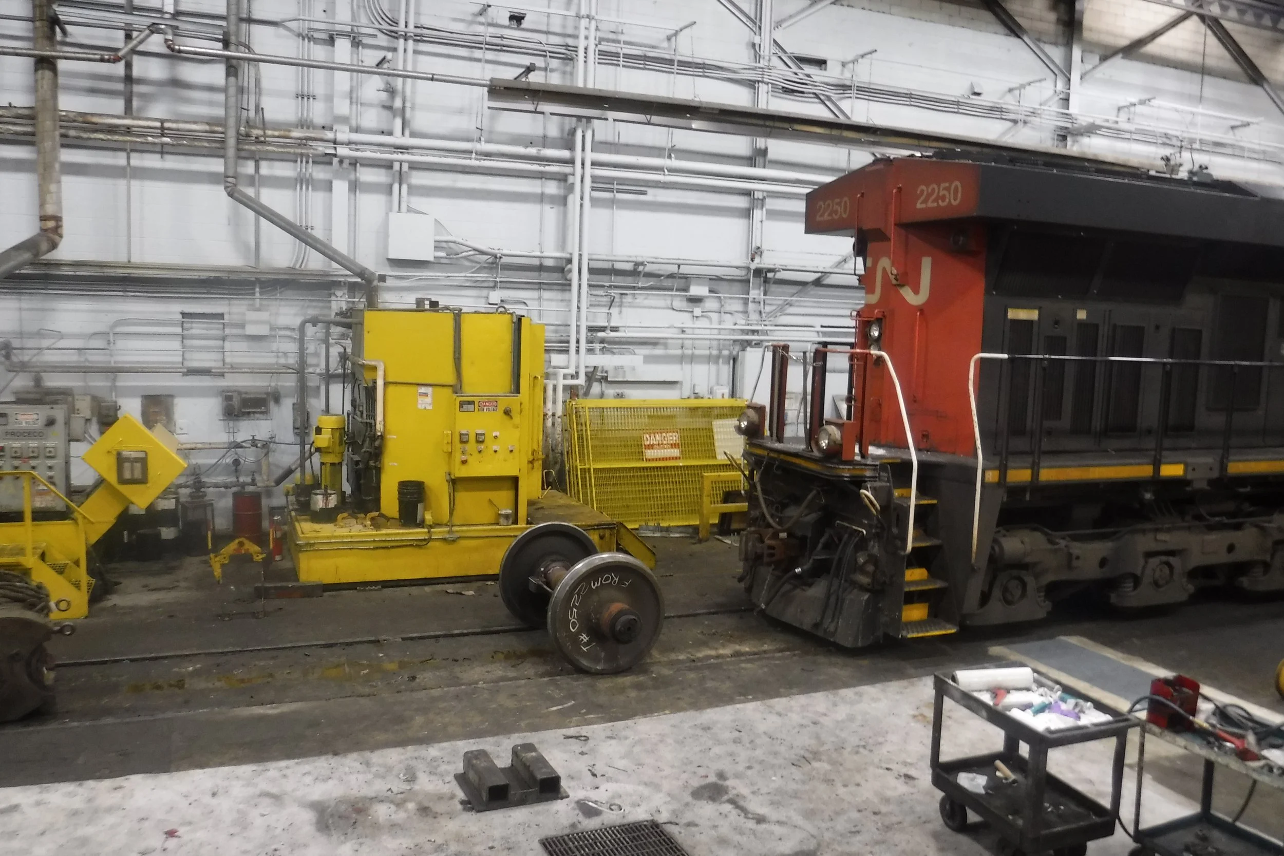 12 months service.  A tough work area.  Wheel sets are rolled across the floor as well....unprotected.  This will cause pre-mature wear...but the SureBond Silikal(r) floor IS repairable with a simple overlay at any point.  Repairable, forever, withou