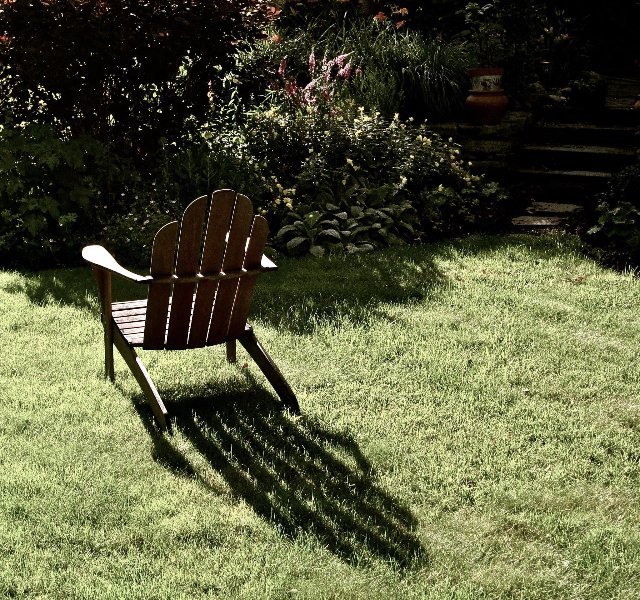 Empty chair sitting in the yard
