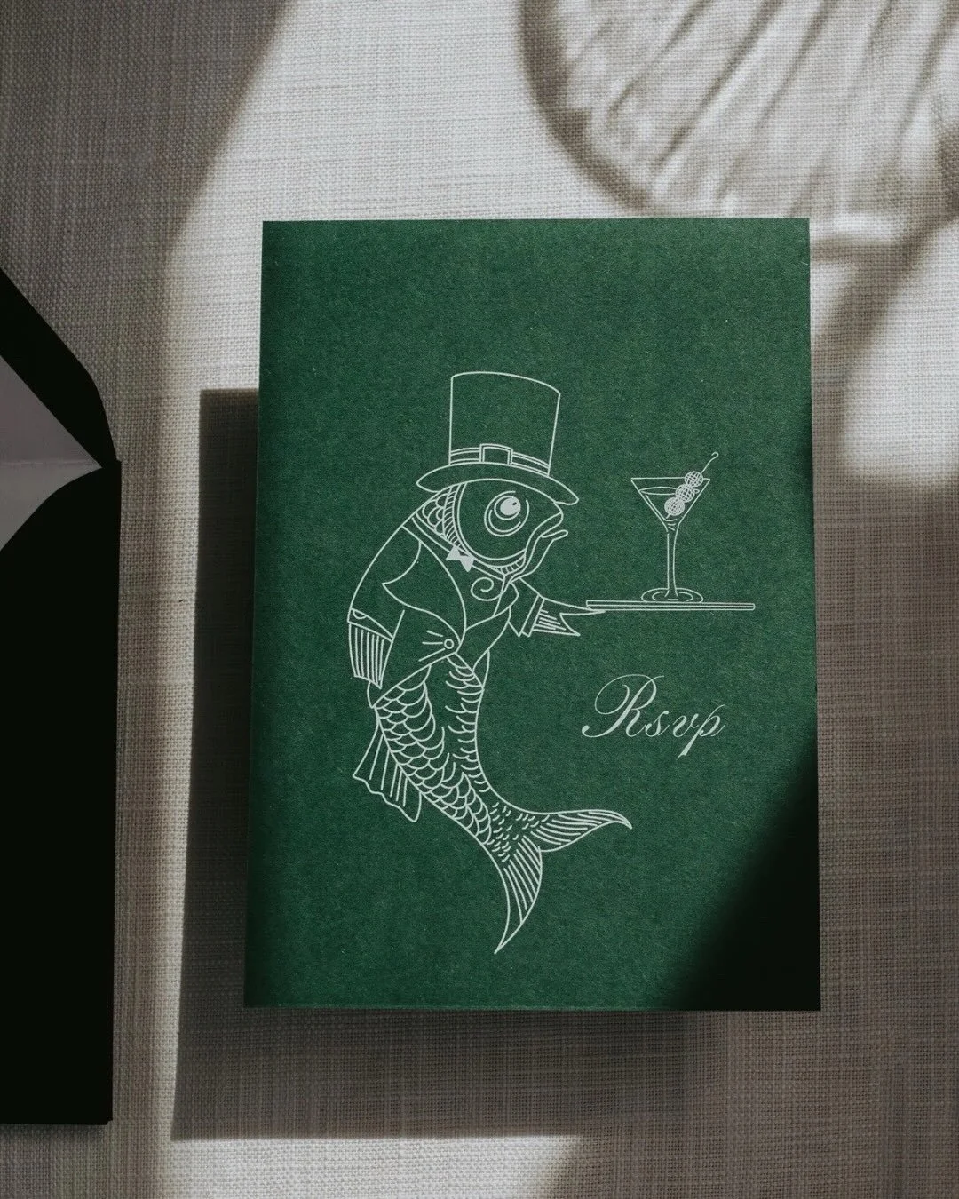 Bonjour 💋. Just your average fish in a top hat, serving martinis and a dose of surrealism. 🍸

Old London glamour, a dash of fantasy, and a sprinkle of &lsquo;did that fish just wink at me?&rsquo; energy.

Hand illustrated, forest green, and unapolo