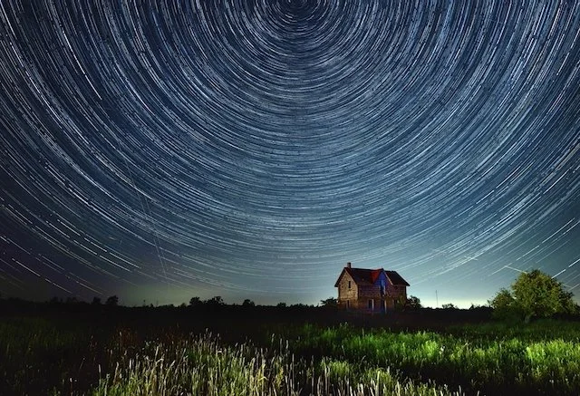 star trails over farm
