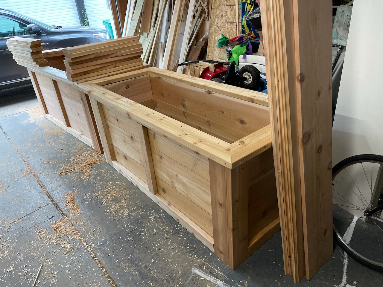 During: large raised wood planter boxes being assembled in the workshop.
