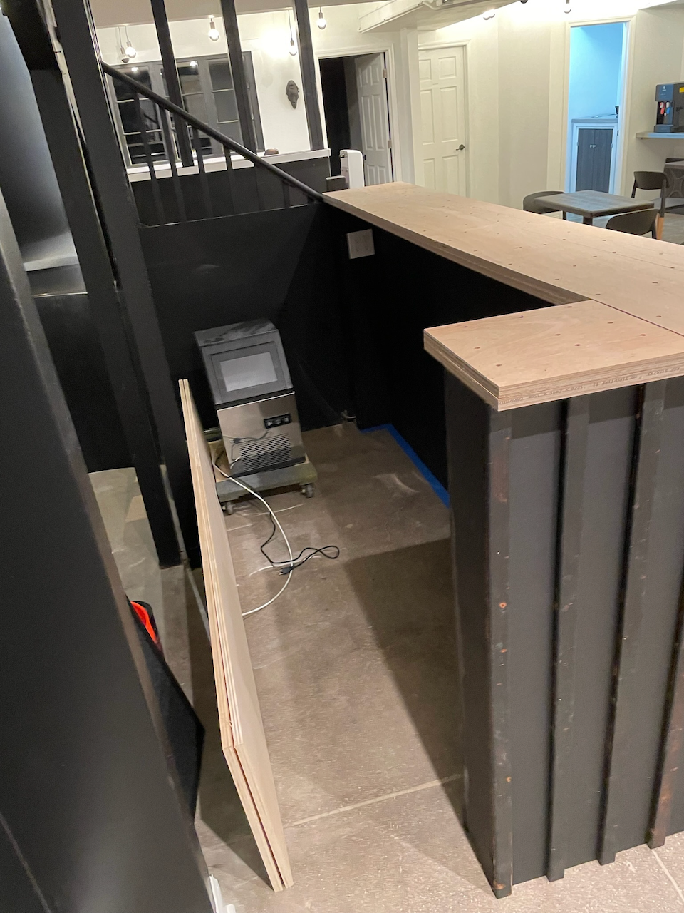During: fitting the wood counter and vertical ribbed bar front.