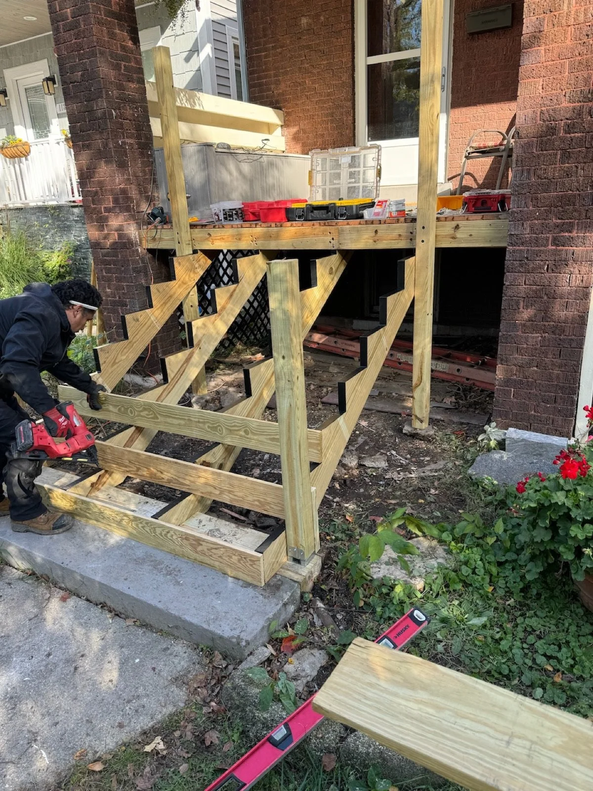 Porch stairs during removal of damaged wood treads, before rebuilding the front entry stairs.