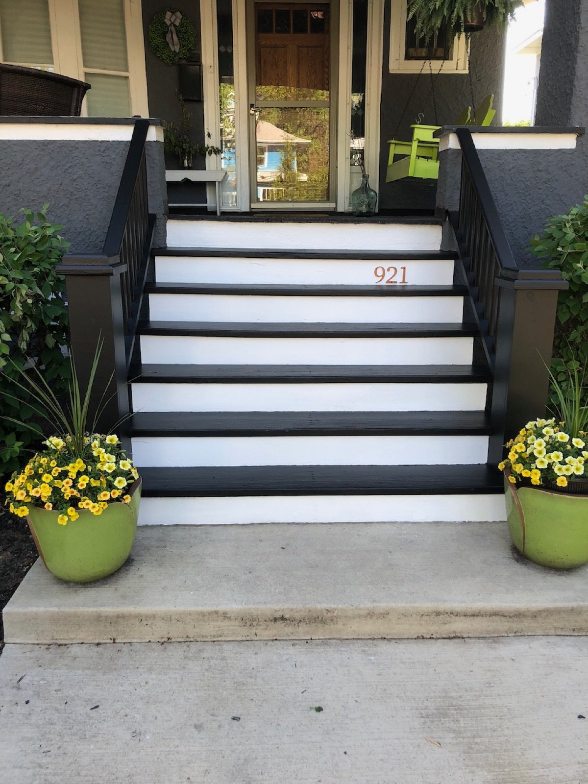 02-finished-front-stairs-with-black-trim-and-white-risers.jpg