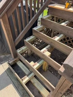 During repair — exposed stair framing — Wood Stair Tread Repairs