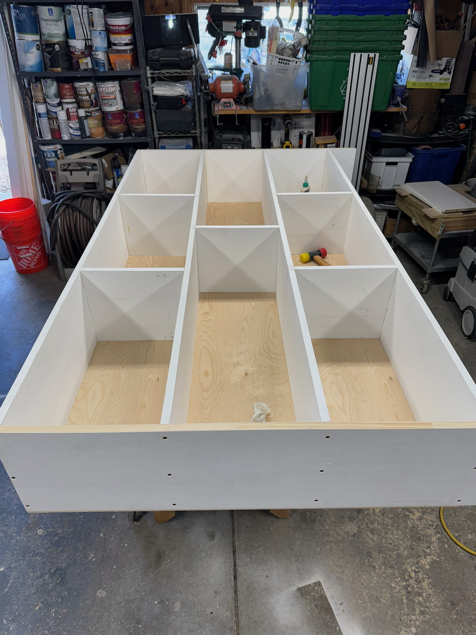 Shelf divisions and painted panels fitted during bookcase construction.