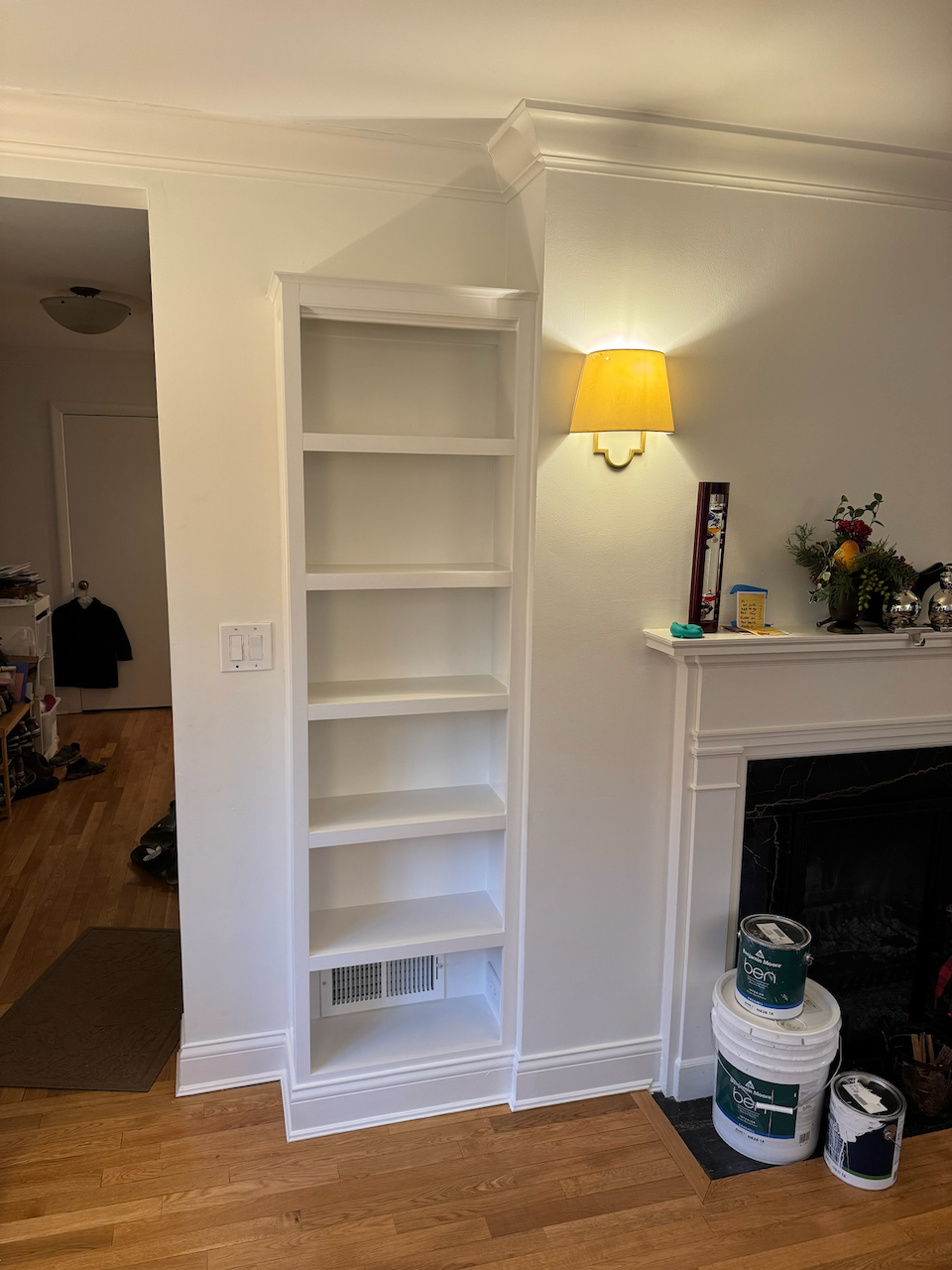 Installed bookcase on the opposite side of the fireplace.