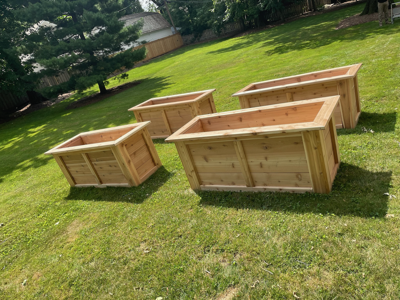 Completed matching raised garden planter set outdoors.