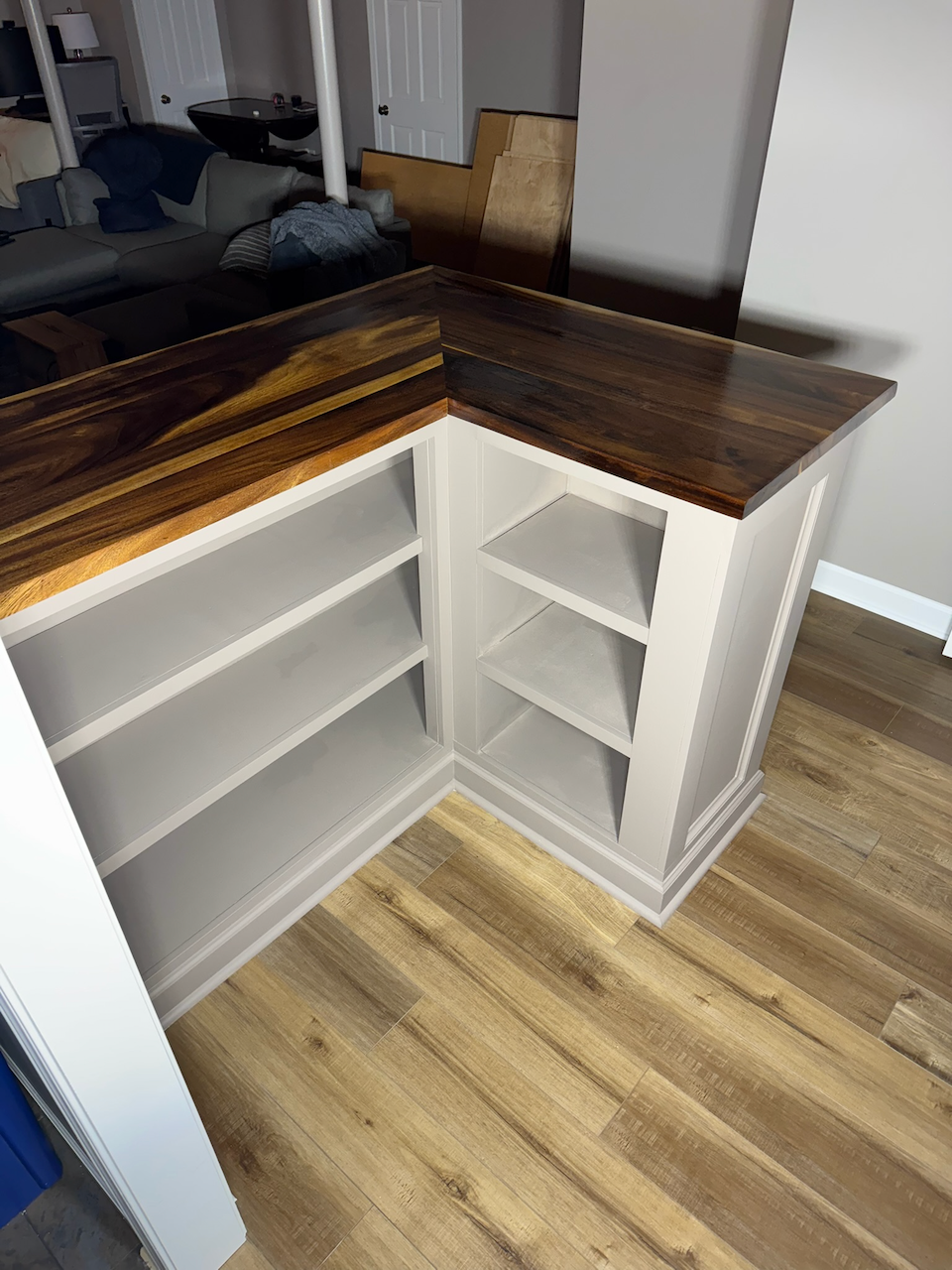 During: inside corner storage and fitted wood countertop.