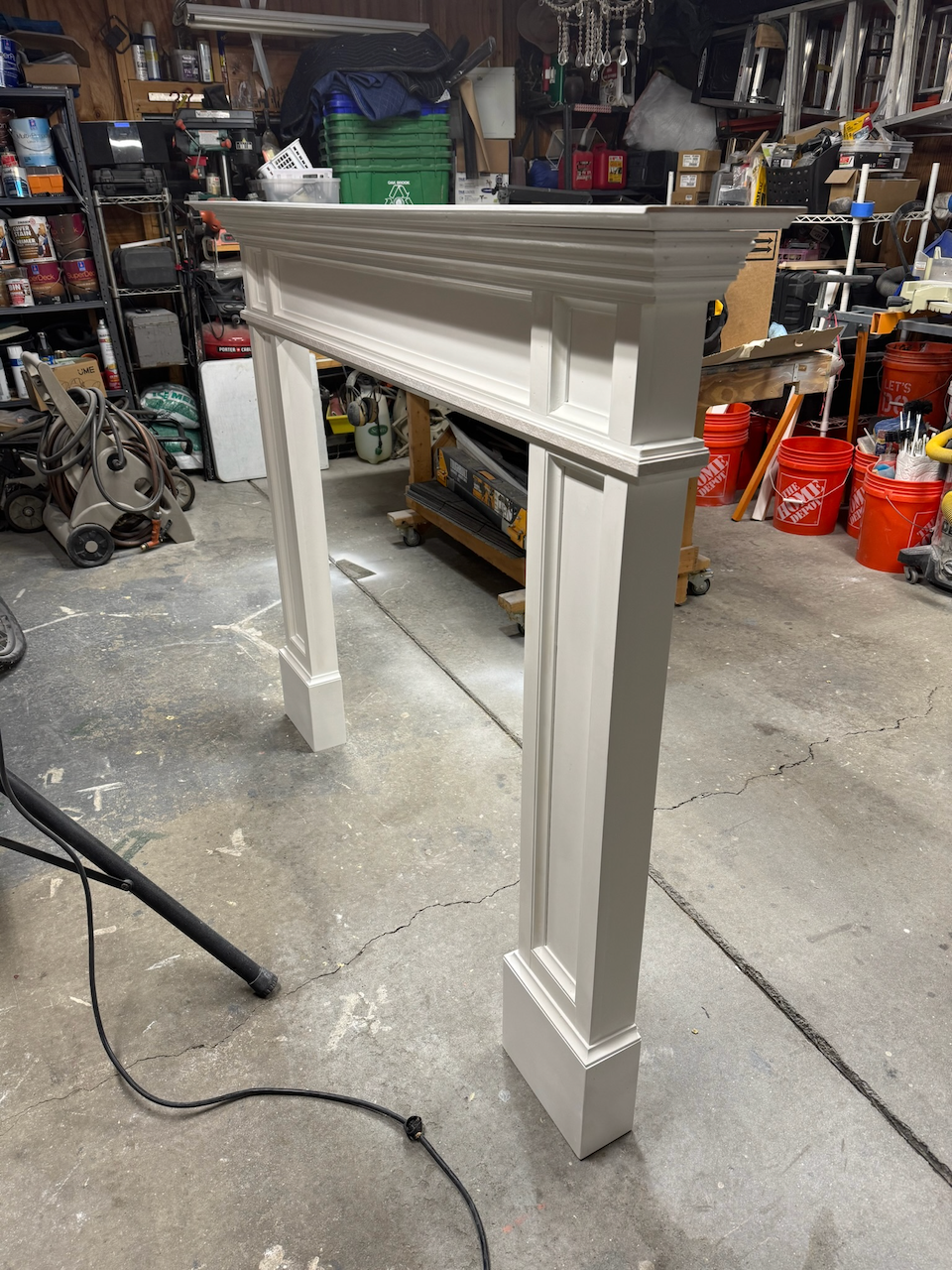 Custom fireplace surround assembled in the workshop before installation.