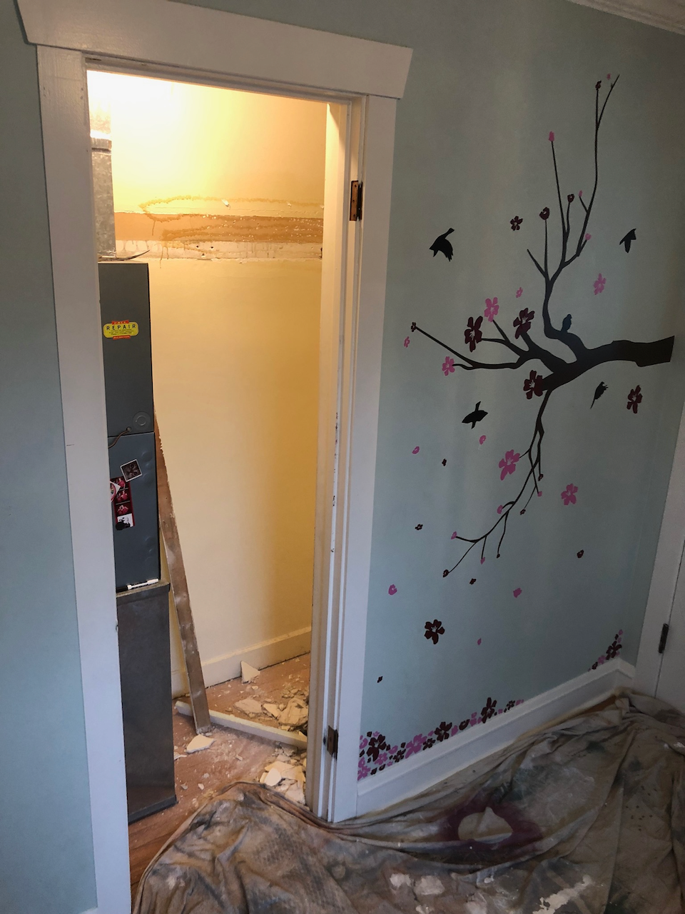 Before: closet opening and surrounding trim before conversion.