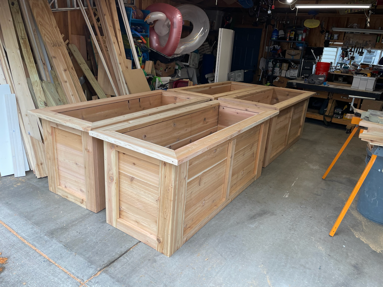 Workshop view of the fitted planter panels, corners and top rails.