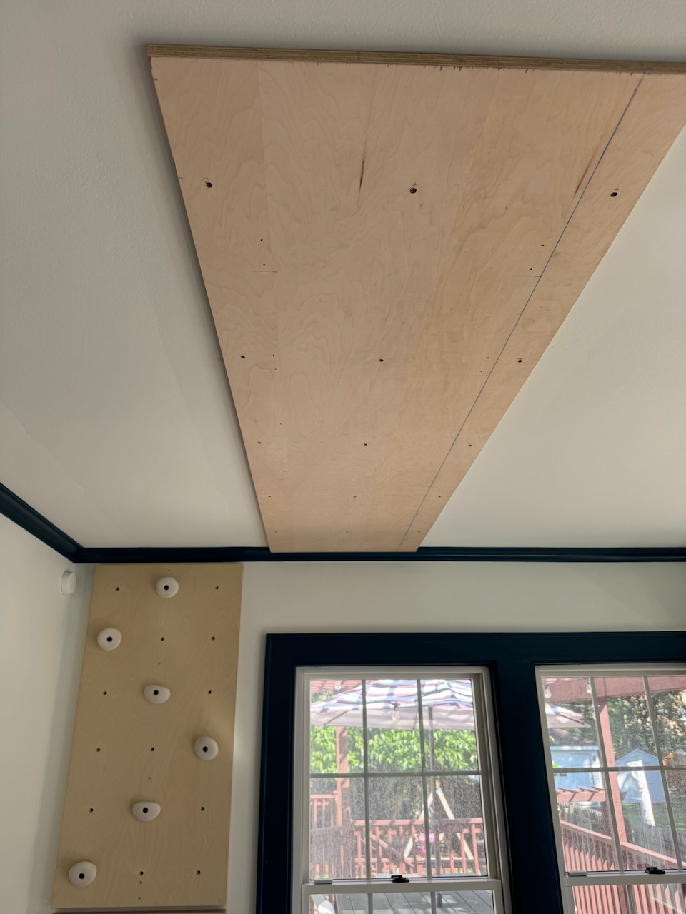 During: ceiling mounting panel and climbing wall installation.