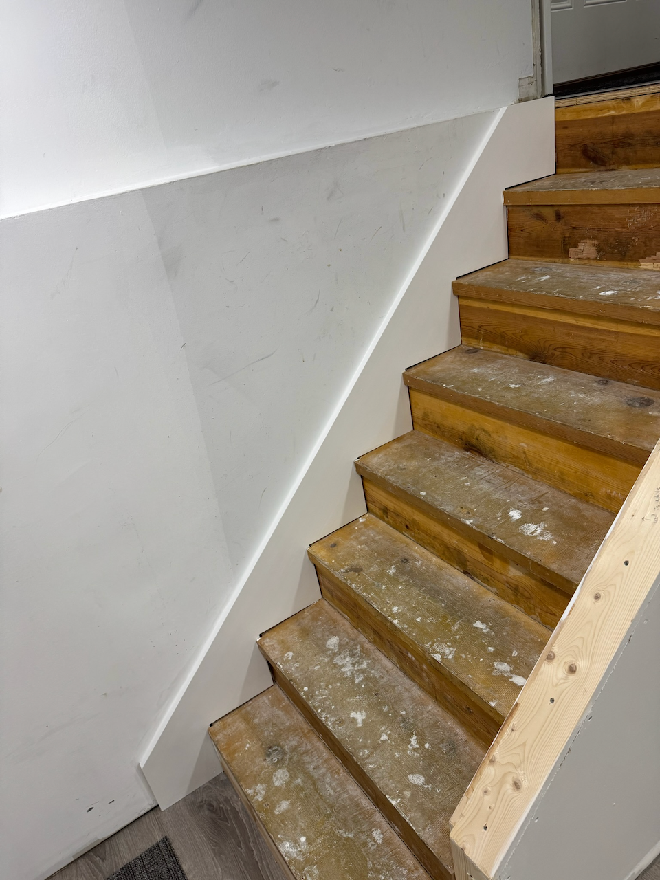 During: stripped stair treads while restoration work is underway.