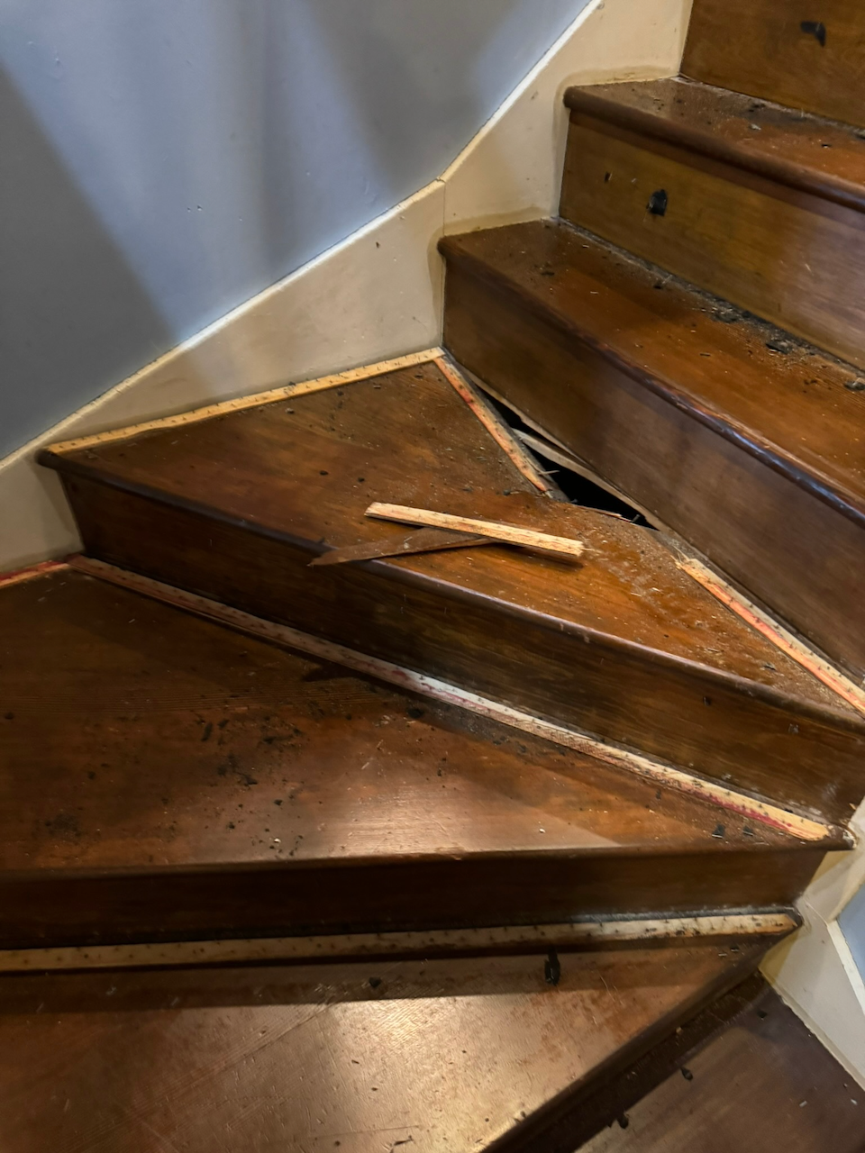 During: fitting and repairing the turning stair treads.