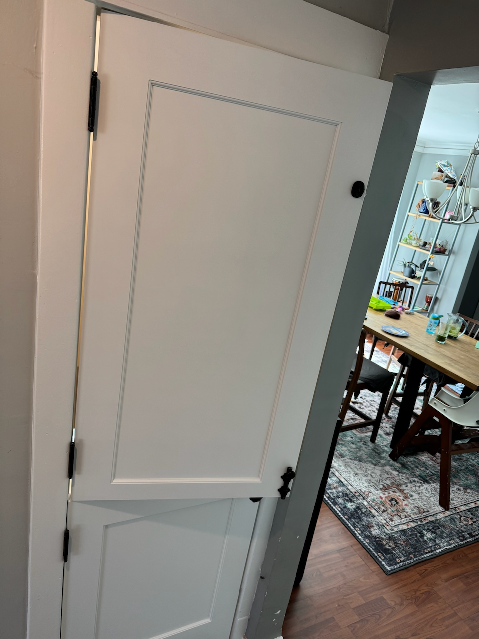 White Dutch door with both halves closed.