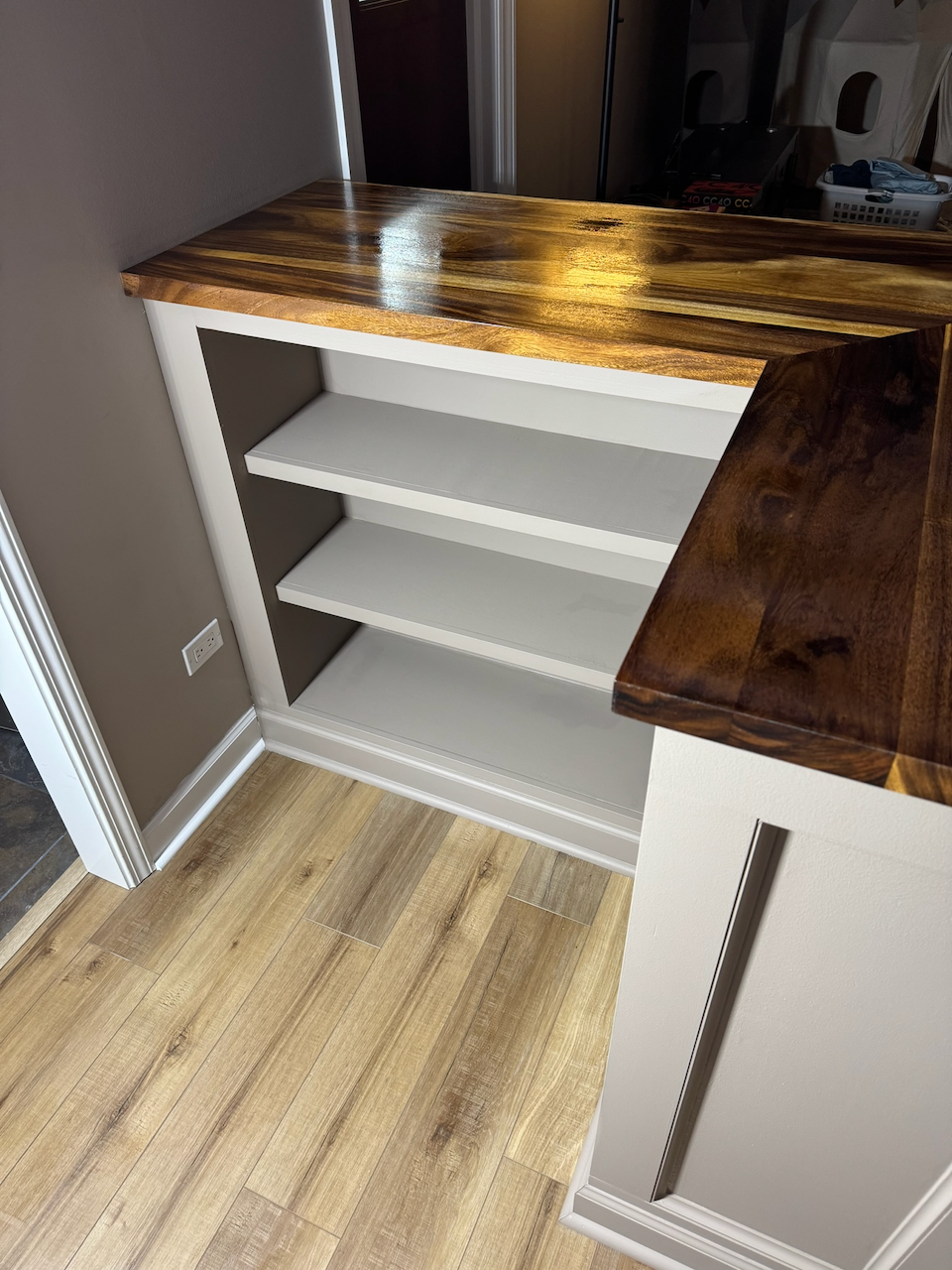 During: open shelving inside the custom bar.