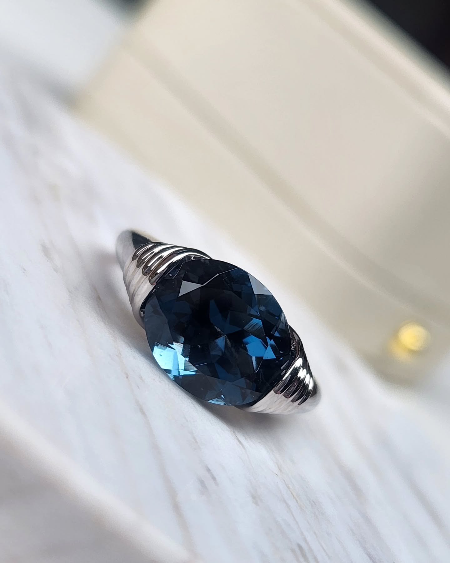 &quot;The Cameron&quot; Ring 

SOLD - Commissioned piece

This time in deep ocean blue natural topaz and solid white gold 💙🩵🤍

Midnight elegance meets sculptural design 

This striking ring features a deep blue oval-cut London blue Topaz, mysterio