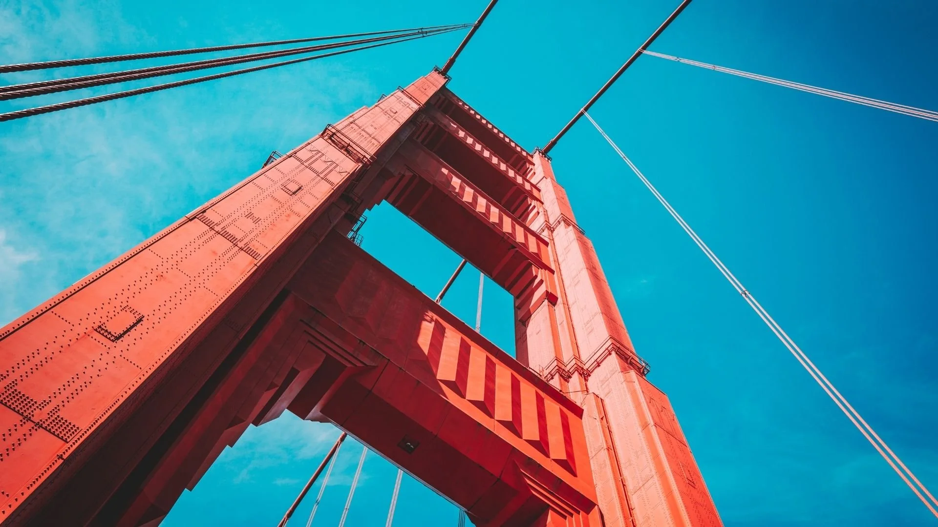 Looking up at the high pillar of the Golden Gate Bridge in San Francisco