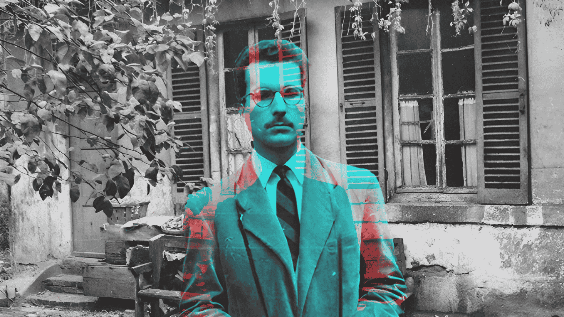 Man standing in front of an old house