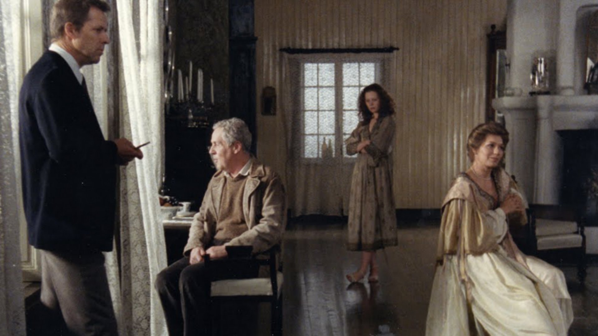 A group of people gathered in a traditional living room