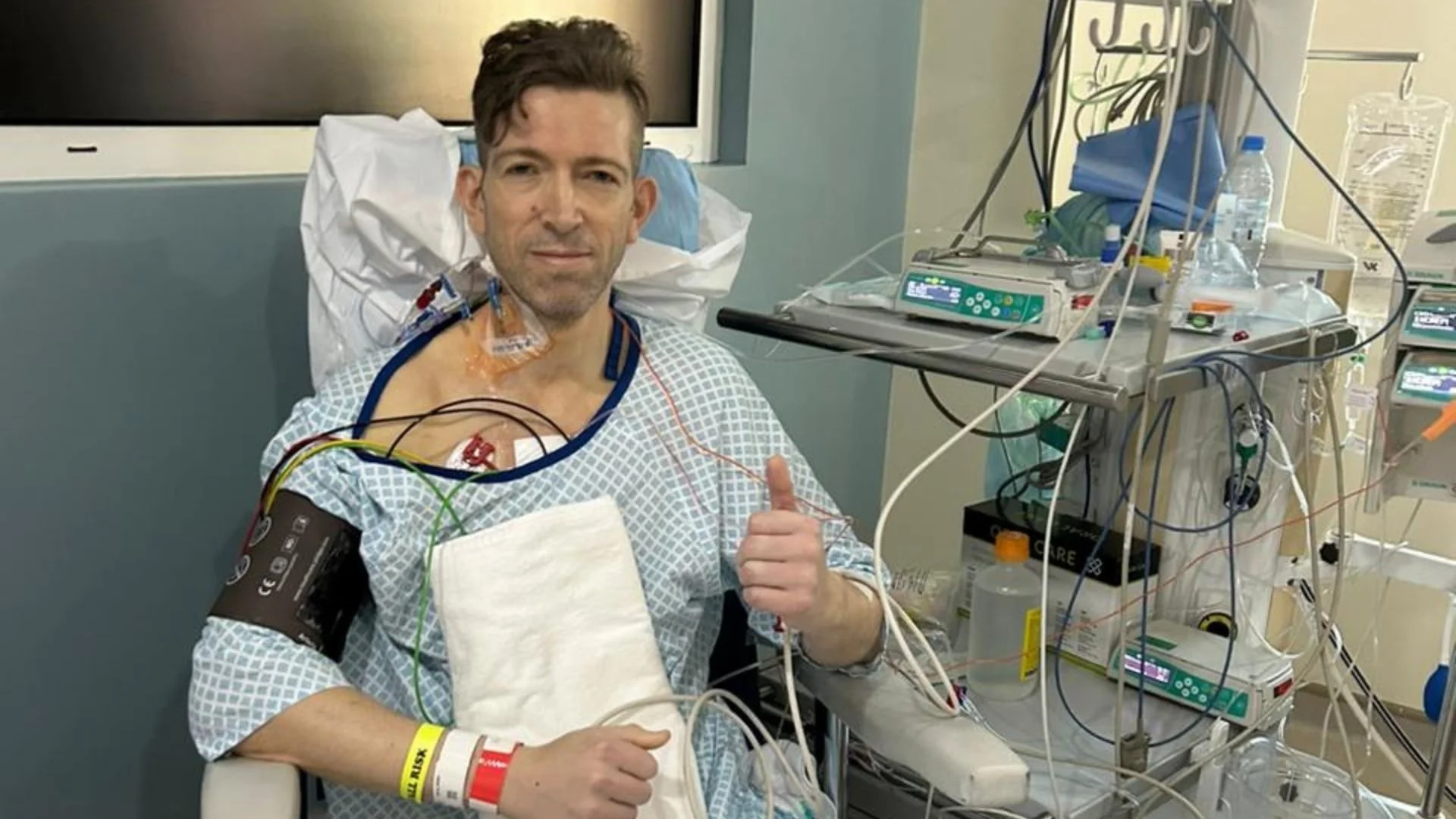 A man in intensive care after successful open-heart surgery