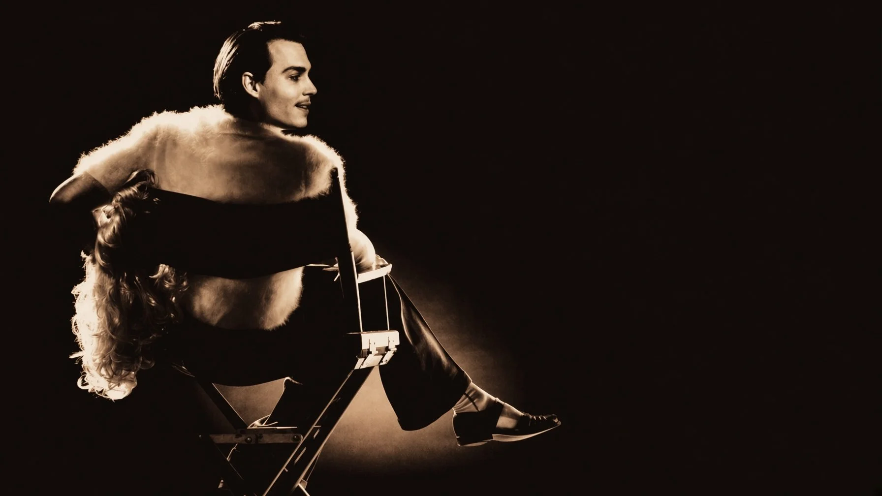 A man sits in a film director's chair