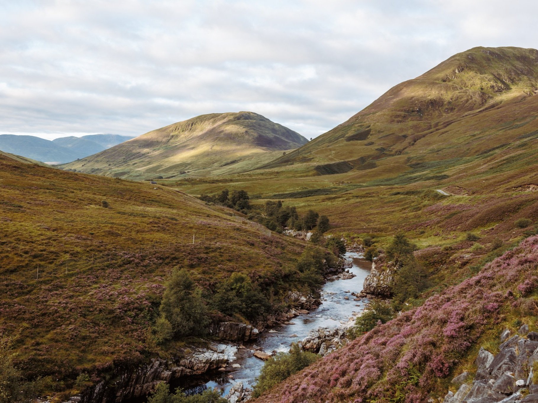 glen roy in late summer with river and heather