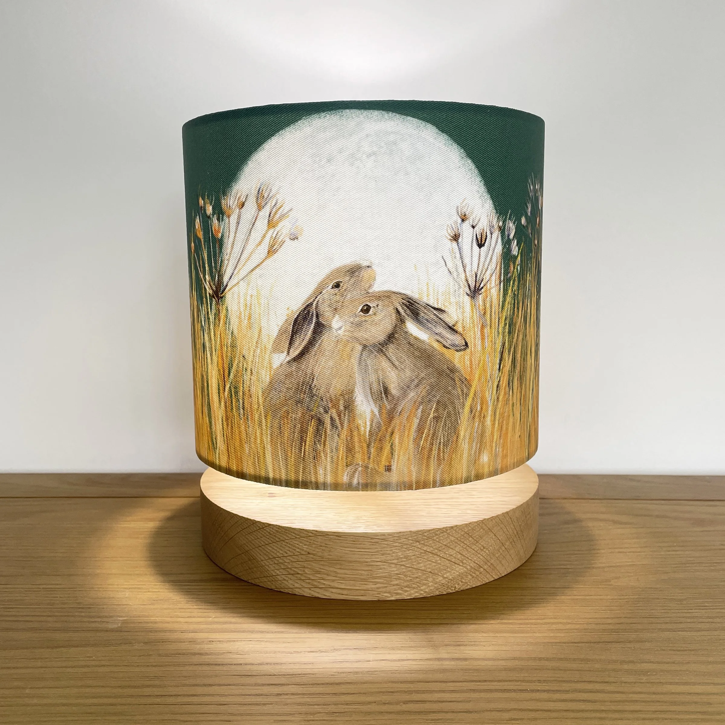 Small Golden Fields Hare Lampshade Illuminated on oak base