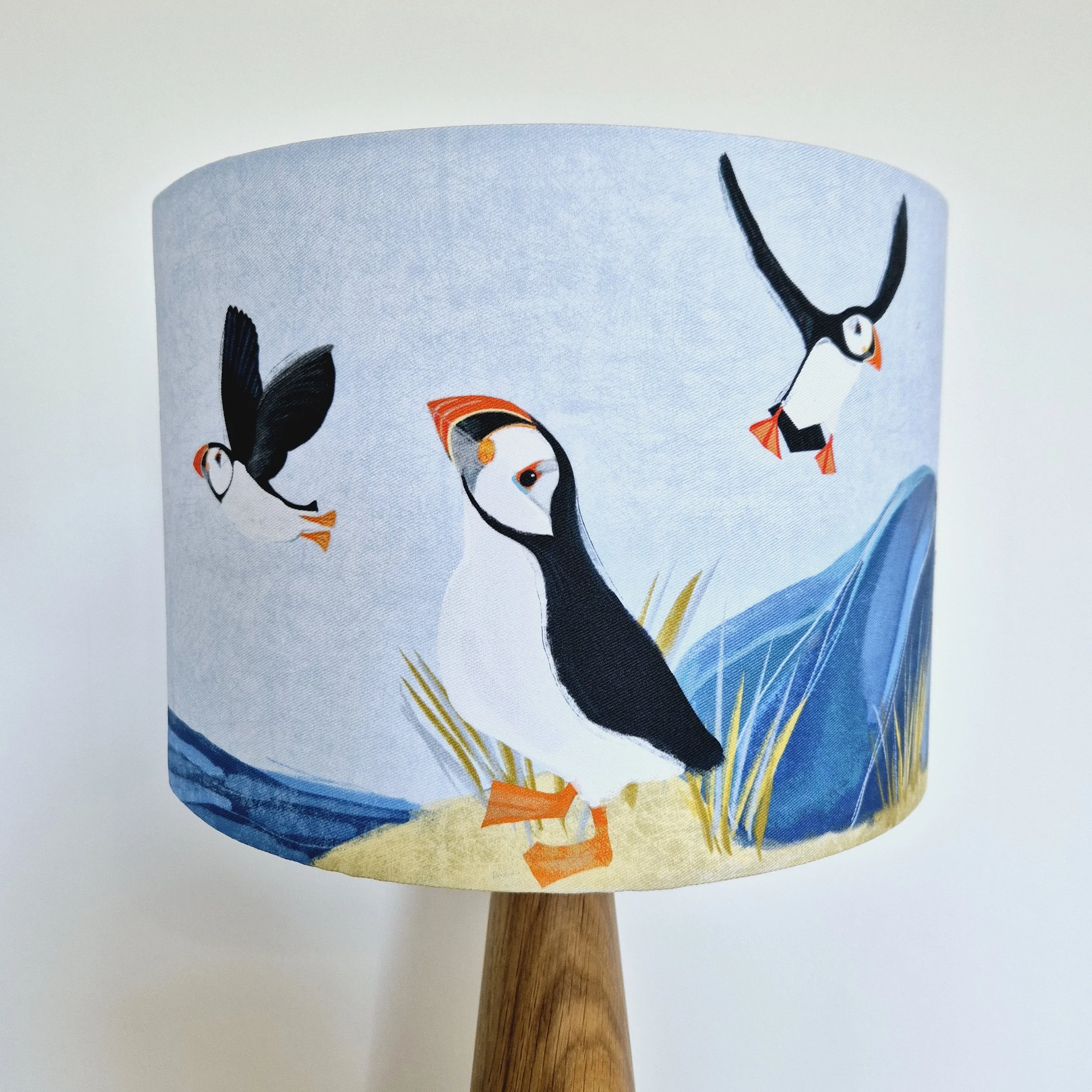 Alternative view of Puffin Island Lampshade by The Hedgerow Artist on oak lamp base