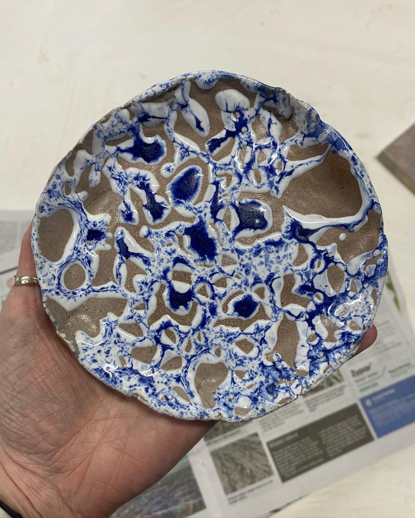 &uarr; Crawling glaze &uarr;
Glaze applied to thick can melt in lumps during the firing, exposing the clay, total accident but quite like it 🍋
Image 1: Fired piece 
Image 2: Glaze applied pre firing