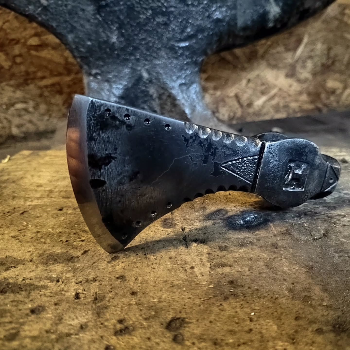 Took a bit of time to modify one of my hand forged axe heads - I usually leave them with a forge finish but this time I did some file and punch work because I had a little spare time to experiment. I also wet rubbed most of the forge scale off using 