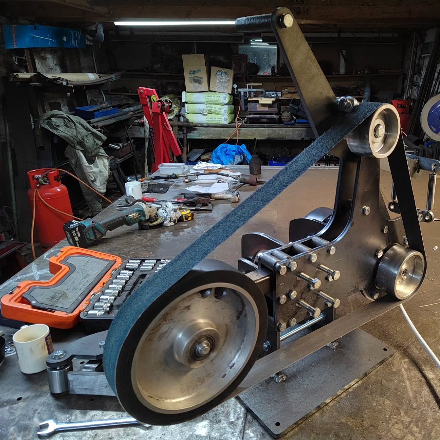 Proud to present the completed prototype mk1 50mm x 2000mm belt grinder.

 Built in house and fitted with 3hp 3 phase motor with vfd control, flat platen and big wheel attachments and 90 degree tilt function.

I am very happy with this machine but th