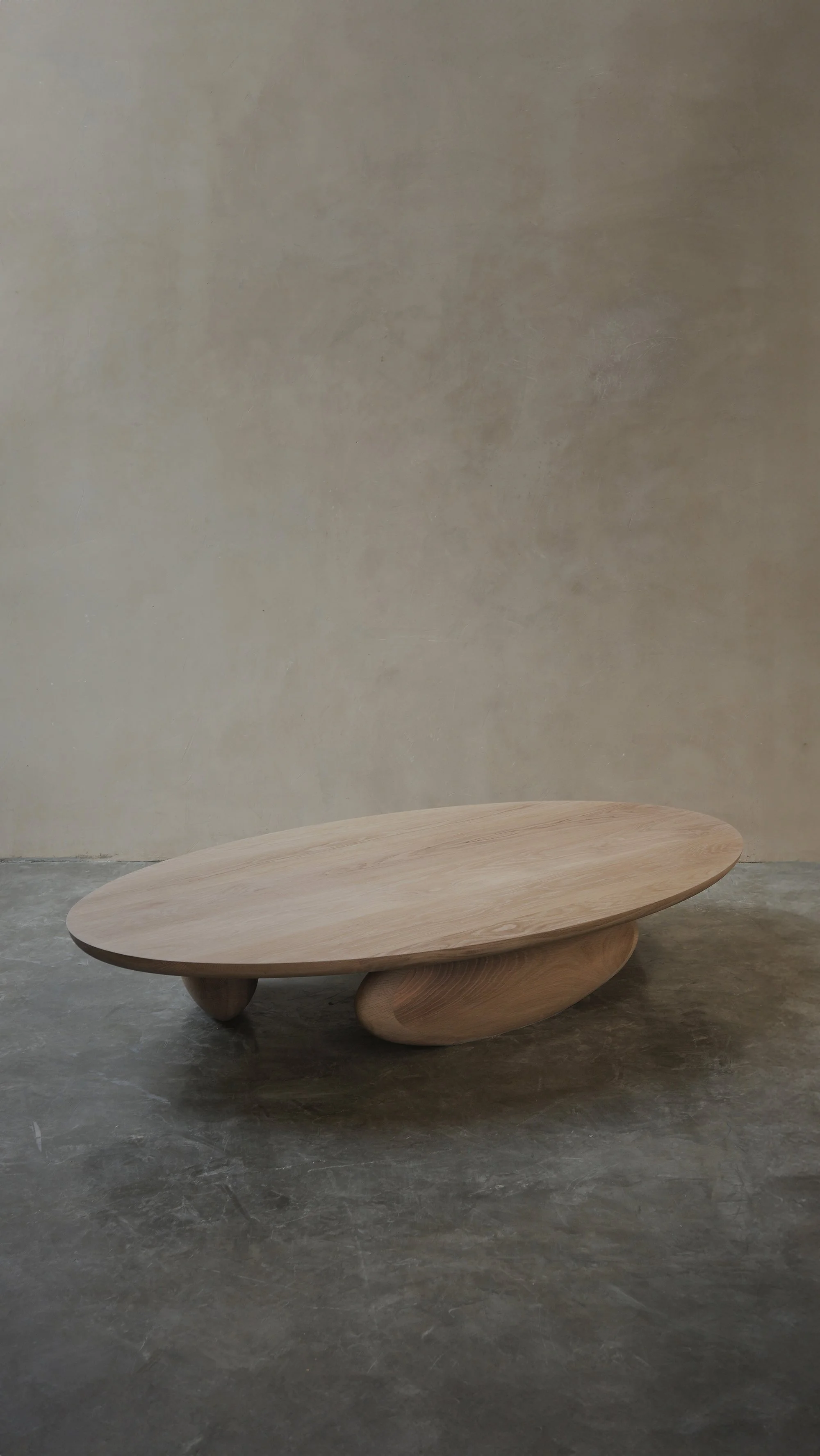 Fishes coffee table with asymmetrical sculptural legs and softly rounded top.