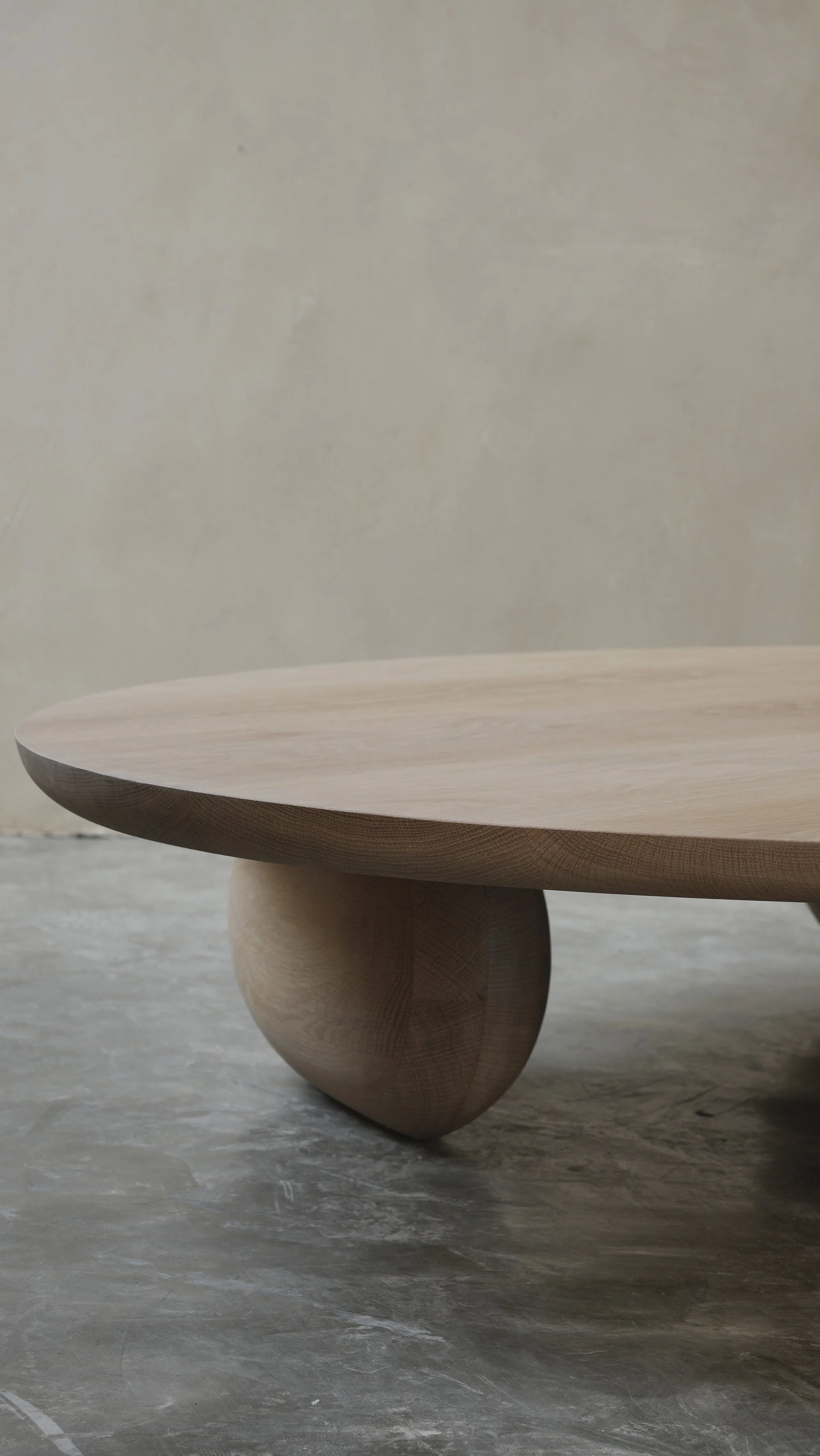 Fishes coffee table with asymmetrical sculptural legs and softly rounded top.