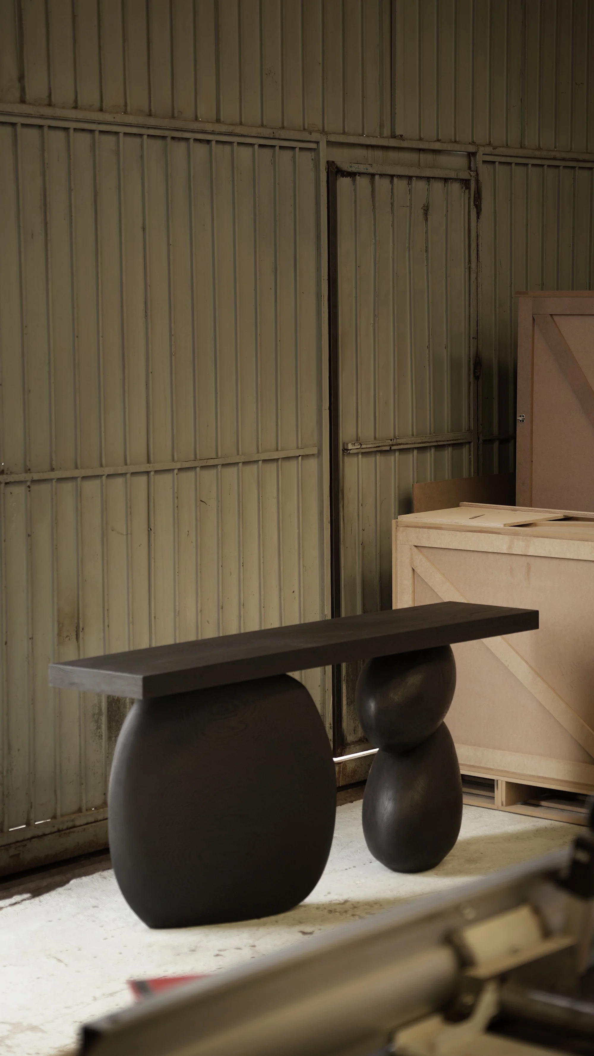 Elefante entry table with rounded oak bases and a thin minimalist top.
