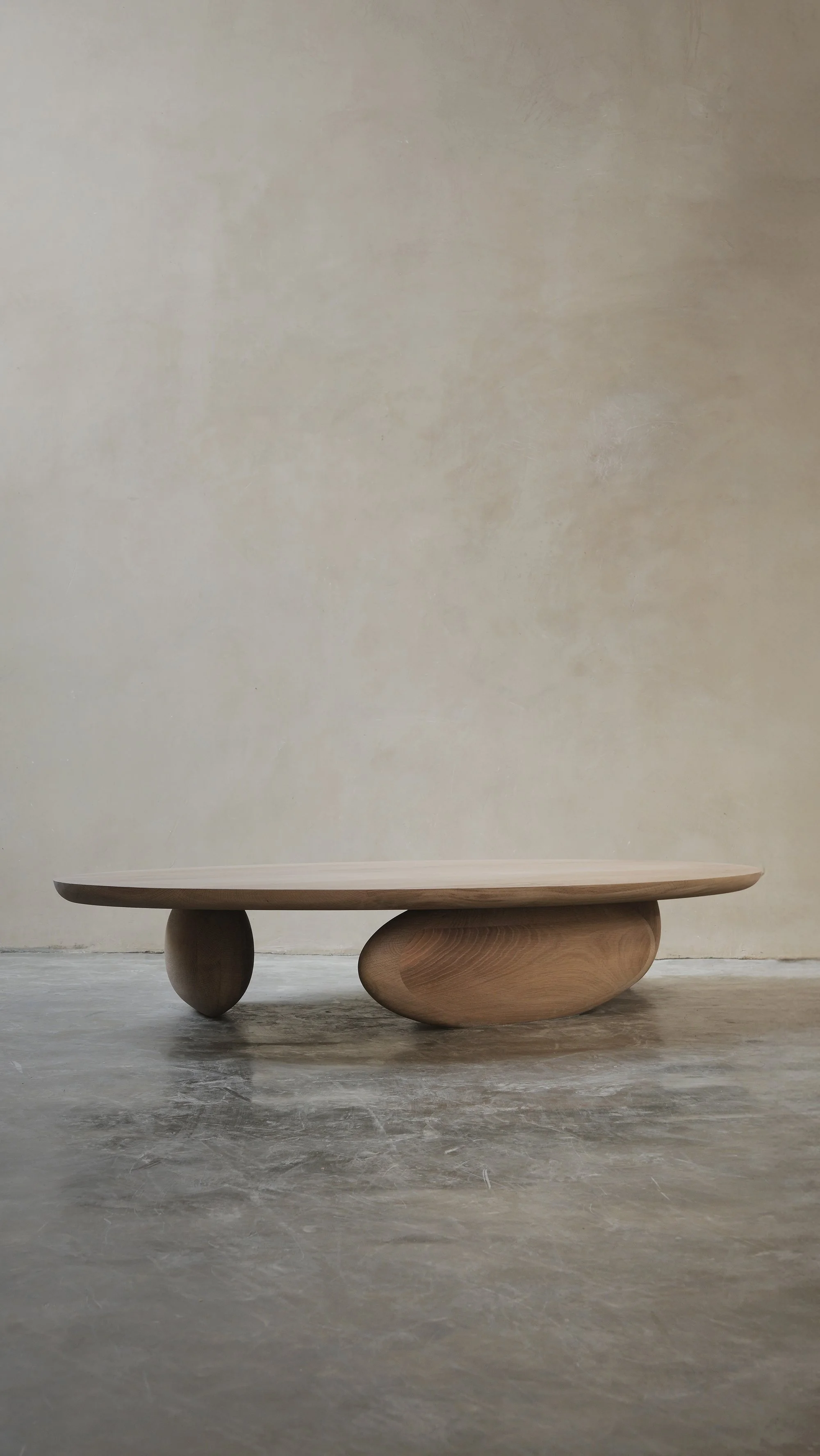 Fishes coffee table with asymmetrical sculptural legs and softly rounded top.