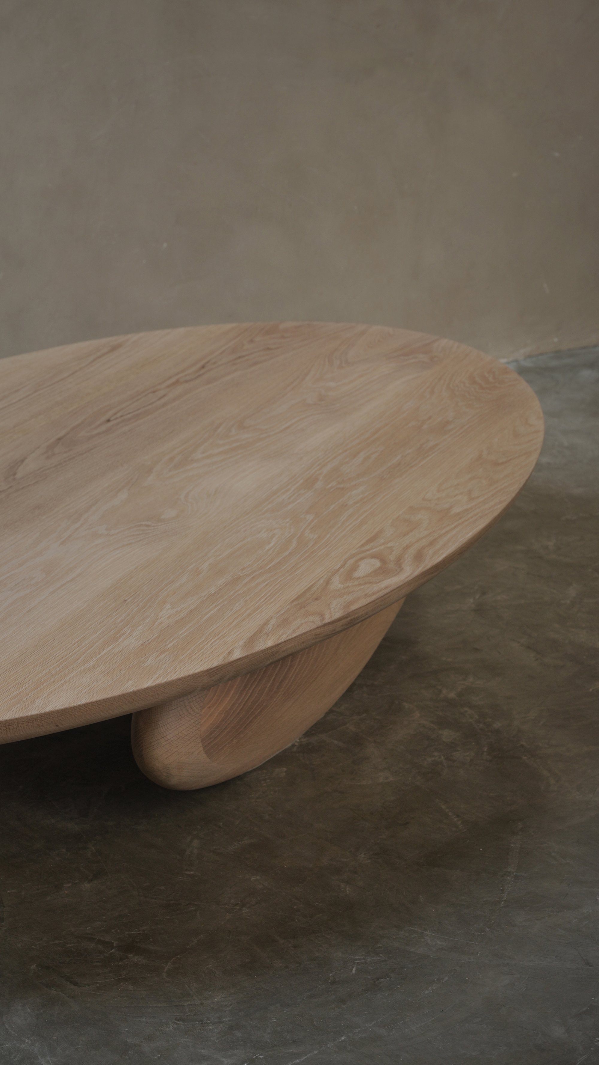 Fishes coffee table with asymmetrical sculptural legs and softly rounded top.