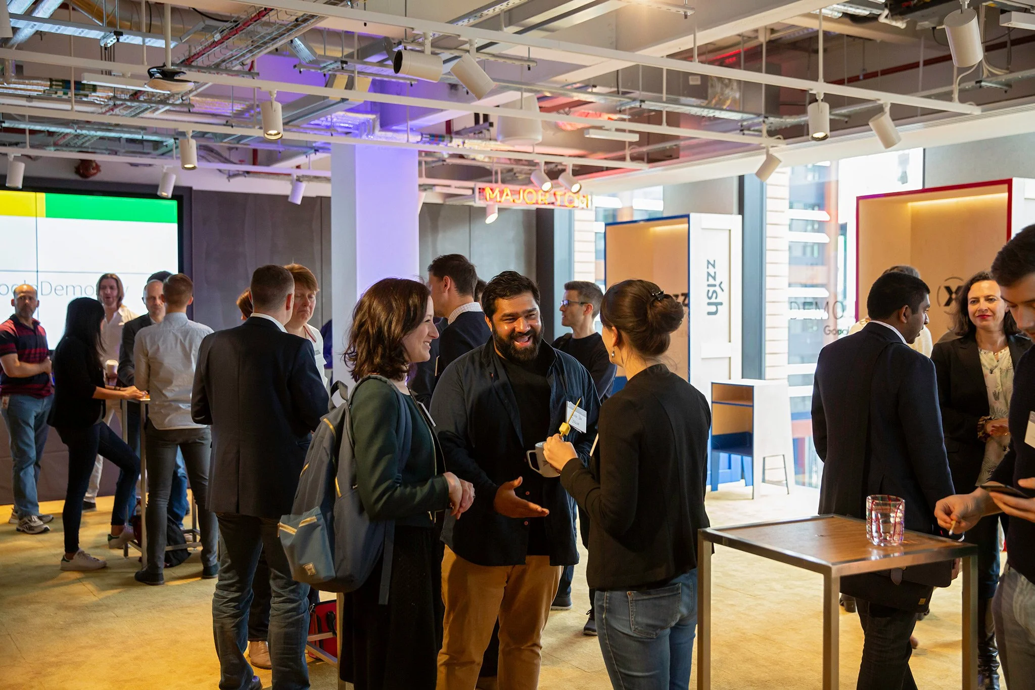Google Demo Day with guests networking at the conference for tech start ups