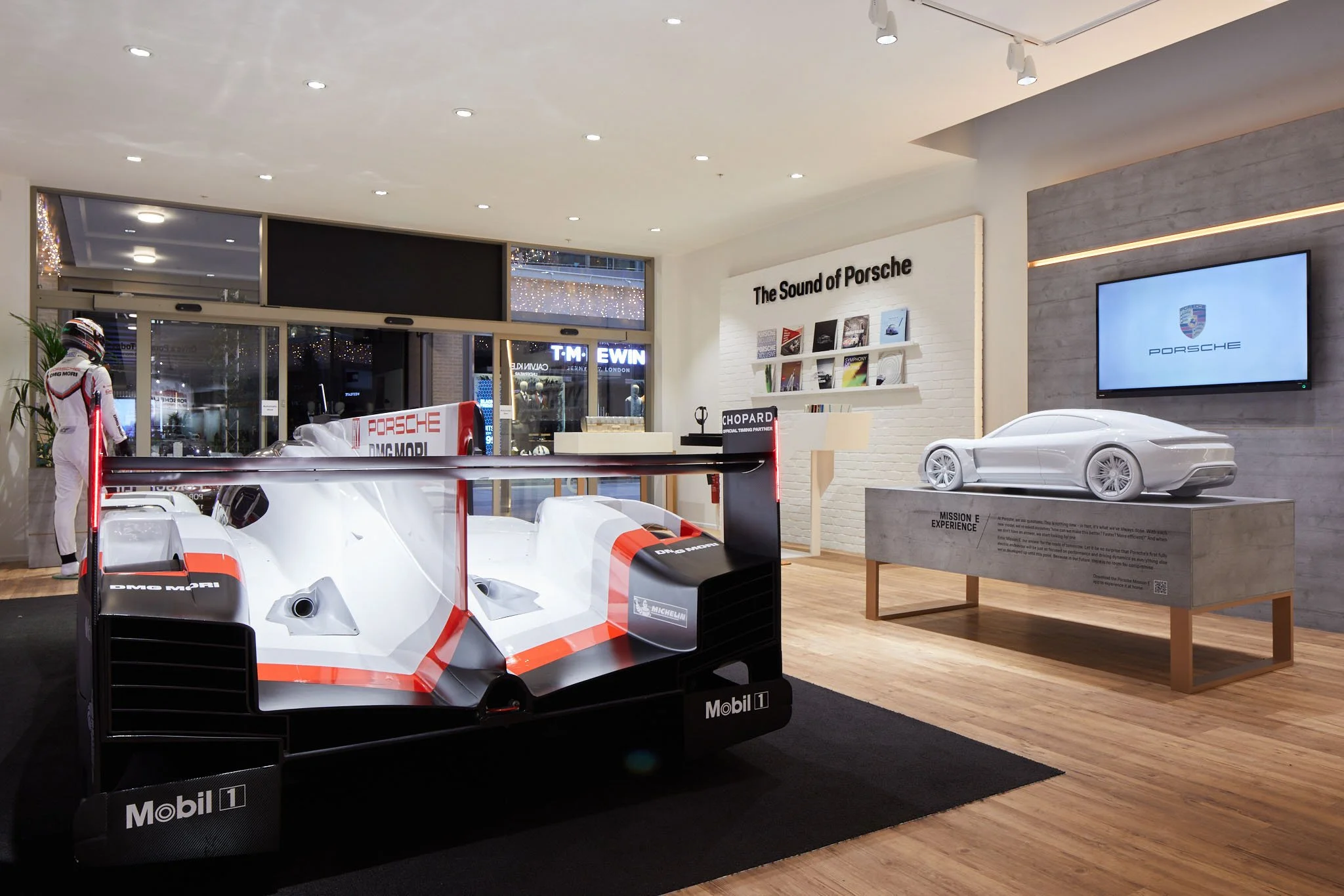 Porsche pop up store retail photography interior featuring vr experience and Porsche race car