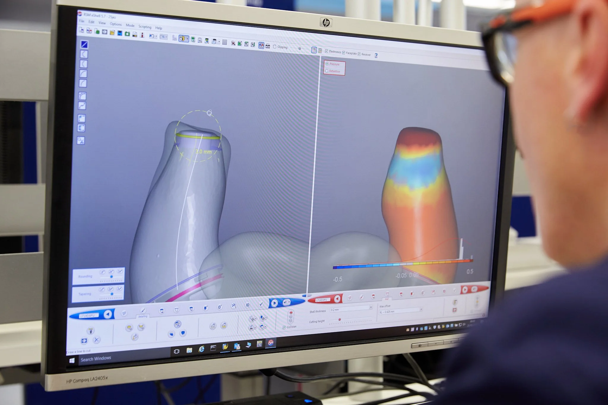 A computer screen displaying 3D digital modeling of teeth. The interface shows detailed color-coded analysis and measurements related to dental or dental implant design.