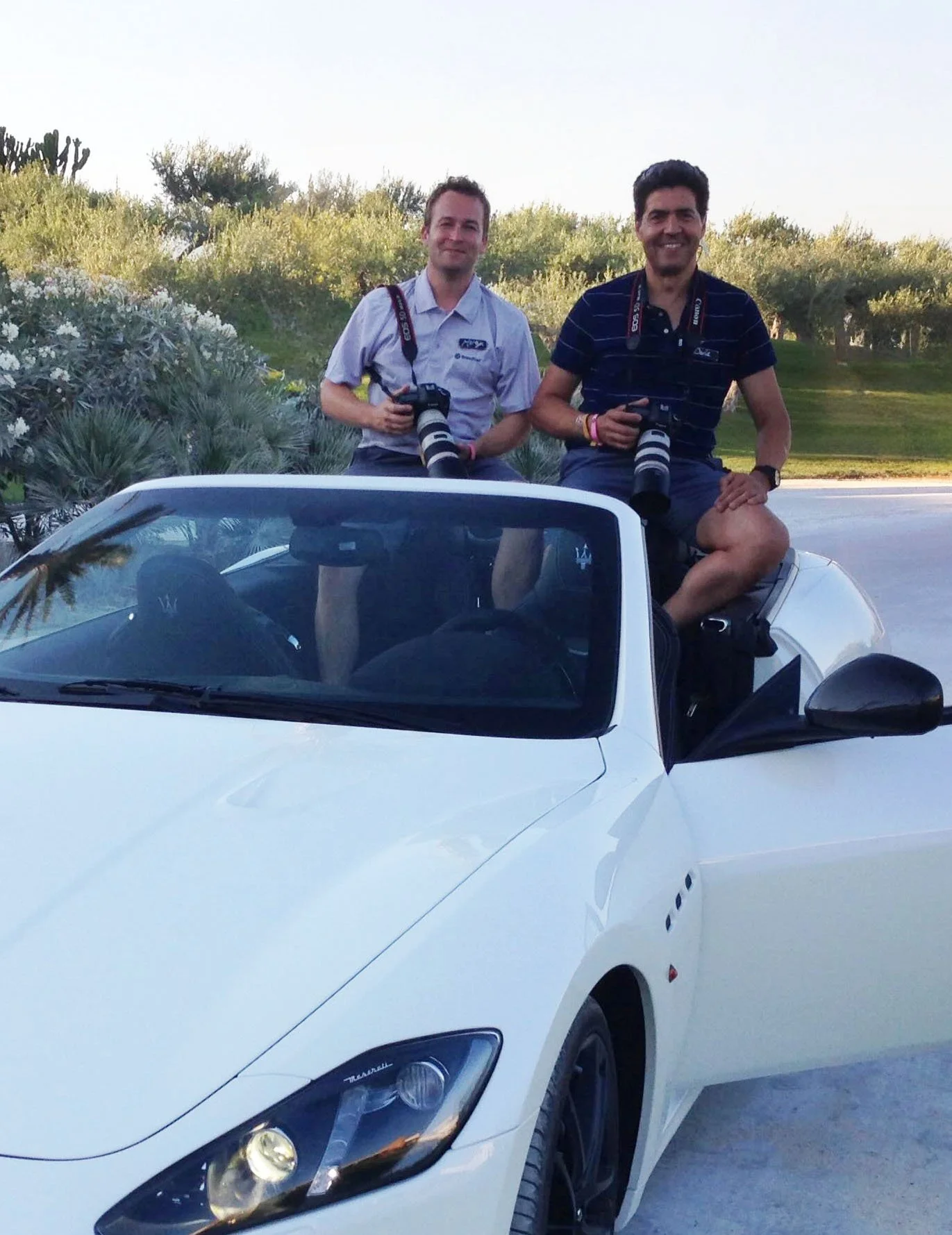 Martyn Hicks Photography in a maserati with colleague at event in Sicily