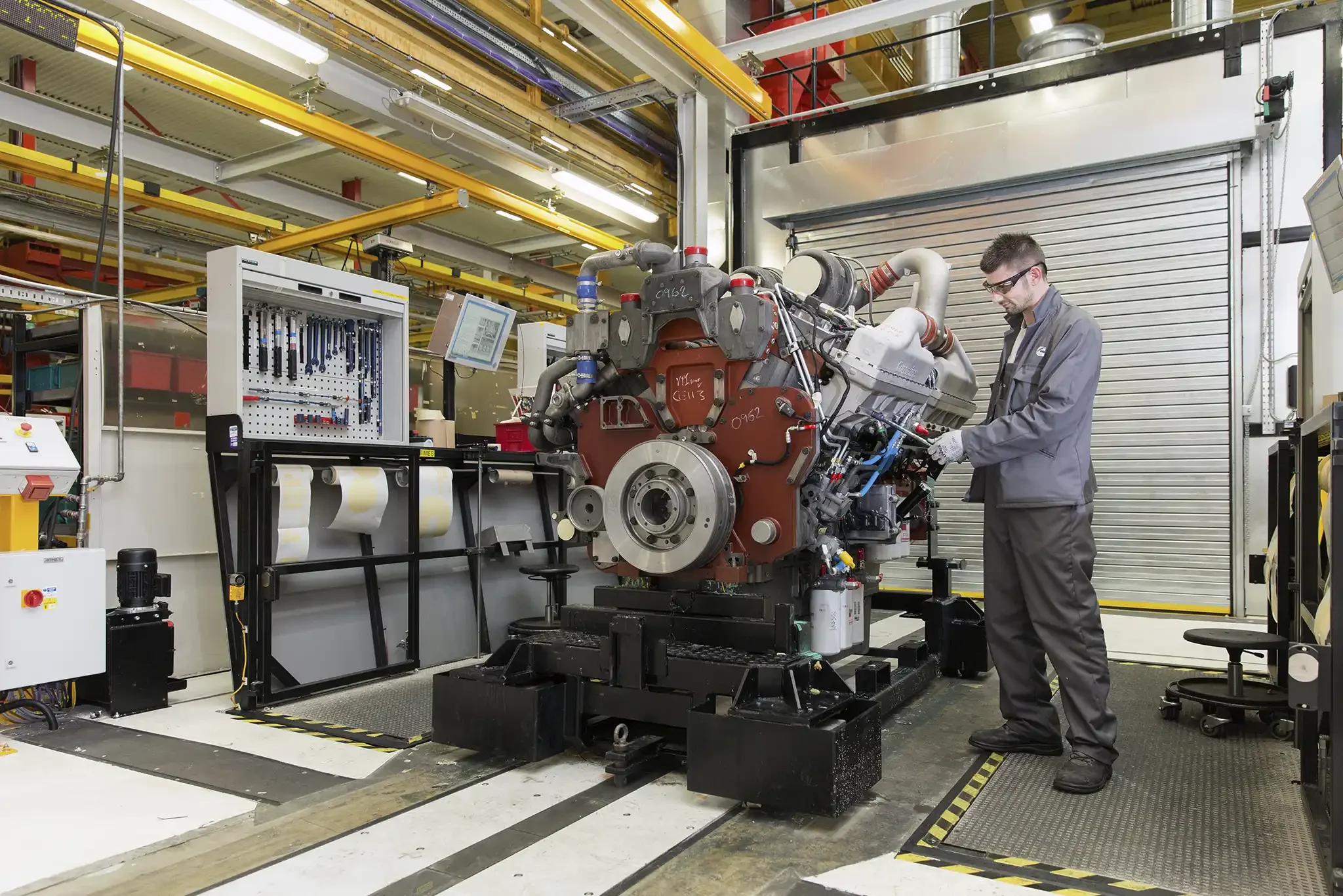Cummins Engines assembly line at the Daventry site with worker making engine